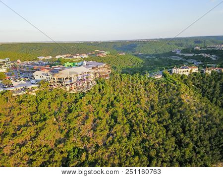Aerial Colorful Restaurant And Vacation Homes In Lush Green Forest