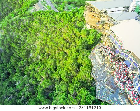 Top View Colorful Restaurant Near Cliff Rock Wall In Austin, Texas, Usa