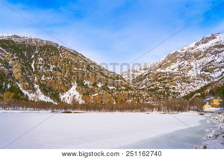 Panticosa snow frozen lake ice in Huesca Pyrenees of Spain
