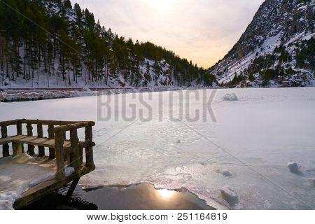 Panticosa snow frozen lake ice in Huesca Pyrenees of Spain