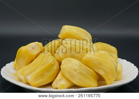 Fresh Jackfruit Slices On A White Plate. Sweet Yellow Jackfruit Ripe. Vegetarian, Vegan, Raw Food. E