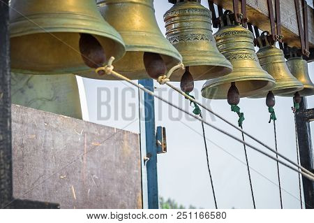 Set Of Church Bells Against The Blue Sky