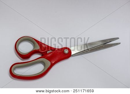 A Red Scissors Isolated On White Background