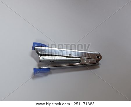 A Silver Stapler Isolated On White Background