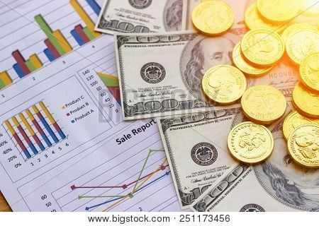 Banknote And Coins Depicted On Economic Graphs Dollar Currency, Financial Investment Concepts That A