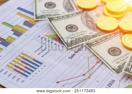 Banknote And Coins Depicted On Economic Graphs Dollar Currency, Financial Investment Concepts That A