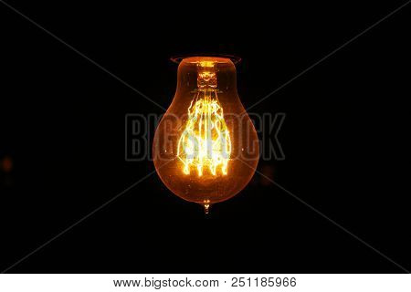 Vintage Light Bulb In The Dark Room