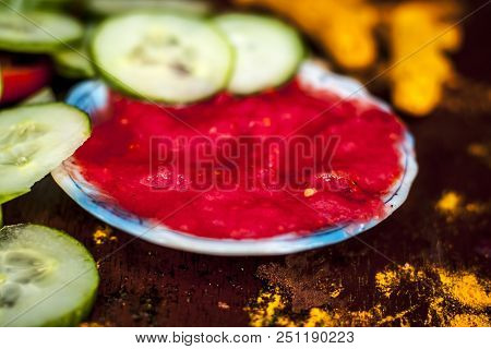 Close Up Ingredeints Of Ayurvdic Face Pack Of Vegetables I.e. Sliced Cucumber,tomato Puree,and Turme