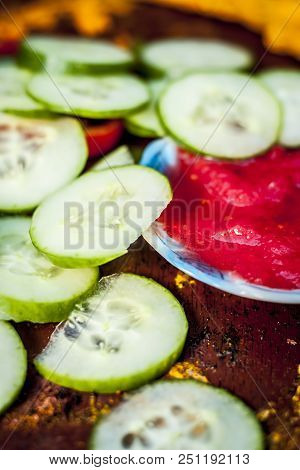 Close Up Ingredeints Of Ayurvdic Face Pack Of Vegetables I.e. Sliced Cucumber,tomato Puree,and Turme