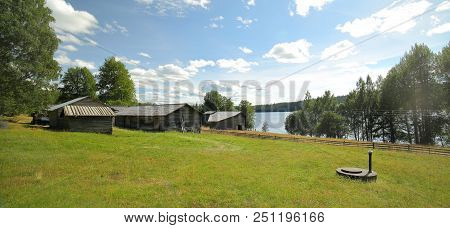 Farm Buildings An Meadow In Cultural Reserve Area Gallejaur In Norrbotten, Sweden