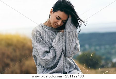 Smiling Dream Female With Closed Eyes With Hand On Blowing Hair. Portrait Of Attractive Brunette Cau