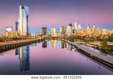 Philadelphia, Pennsylvania, USA downtown city skyline on the Schuylkill River at twilight.