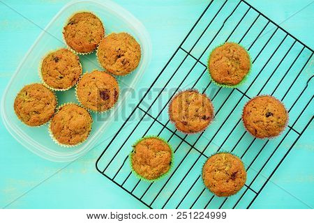 Perfectly Baked Zucchini Cranberry Muffins On Rusric Aqua Background In Flat Lay Composition