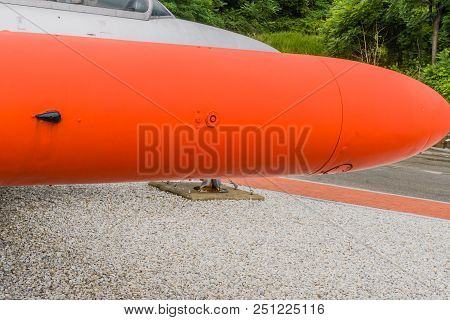 Closeup Of Wingtip Fuel Tank On Small Jet Engine Trainer On Display In Mountainside Public Park With