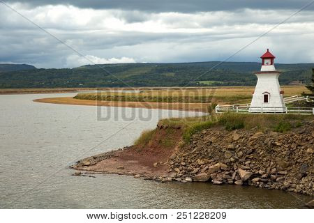 Anderson hollow lighthouse with a grey cloudy sky in New Brunswick in Canada