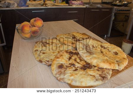 Traditional Georgian Cuisine - Bean Filled Bread (lobiani) On Wooden Table, Traditional Flatbread. F
