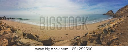 Panoramic Coastal View Of A Sandy Beach And The Point Mugu Rock Along Pacific Coast Highway, Point M