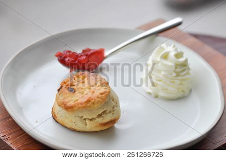 Scone With Whippied Cream And Strawberry Jam