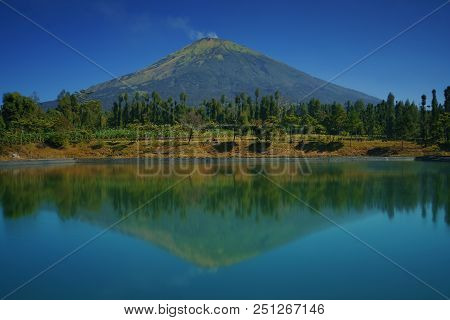Reflection Of Sindoro Mountain From Embung Posong