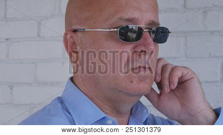 Bodyguard Image Using Discreet Ear Phones For Communication