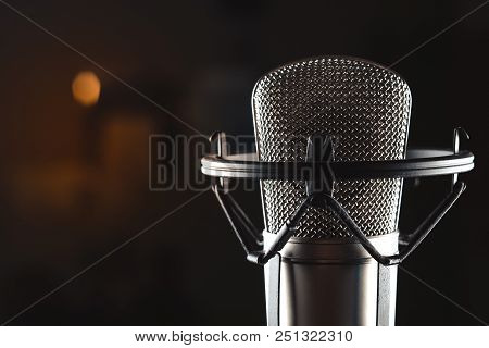 Professional Studio Condenser Microphone On Black Background
