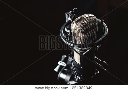 Professional Studio Condenser Microphone On Black Background