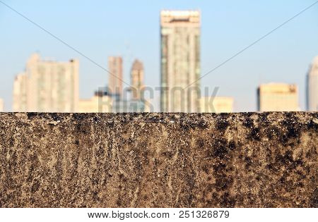 Seeing Concrete Jungle, High Building After Big Concrete Barrier