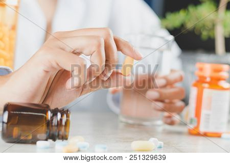 Close Up Of A Woman Hand Holding A Vitamin Pill