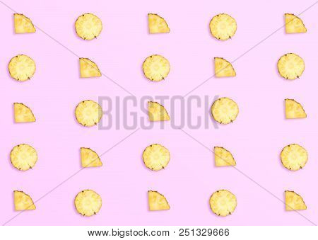 Pineapples On Pink Background. Pattern Made Of Sliced Pineapples. Top View Minimal