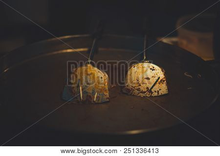 Dirty pan with turner and oil in iron pan after finished cooking food