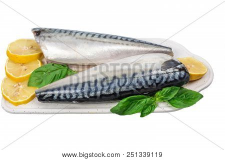 Raw Mackerel With Lemon And Basil On White Cutboard Isolated On White Background. Close Up