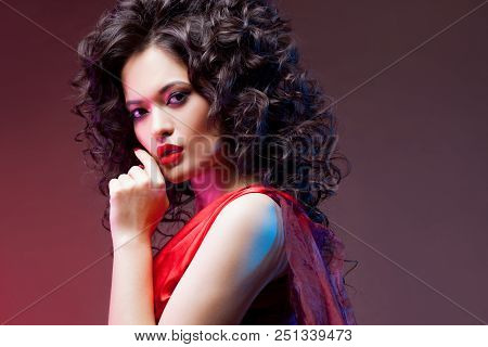 Big Hair. Voluminous Curls. Thick And Voluminous Hair, Portrait Of A Beautiful Young Woman With Red 