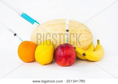 Fruits On A White Background Bananas, Orange, Melon, Lemon And Nectarine In Which Gmo And Nitrates A