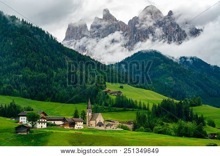 Beautiful Landscape Of Dolomites Italy With The Church Of St. Magdalena Or Santa Maddalena In The Gr