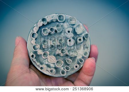 Object Printed On Metal 3d Printer. Dental Crowns Created In A Laser Sintering Machine Close-up. Dml