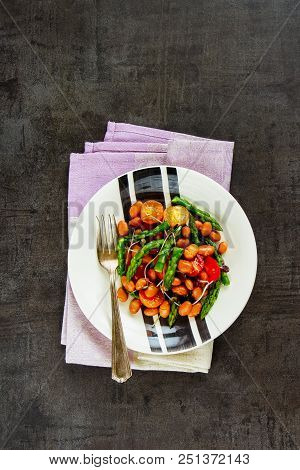 Plate Of Vegan Beans Salad On Dark Background. Flat-lay Of Healthy Energy Boosting Salad With Asparg