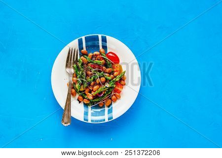 Vegan Salad On Blue Background Flat-lay. Healthy Energy Boosting Beans Salad In Plate With Aspargus,