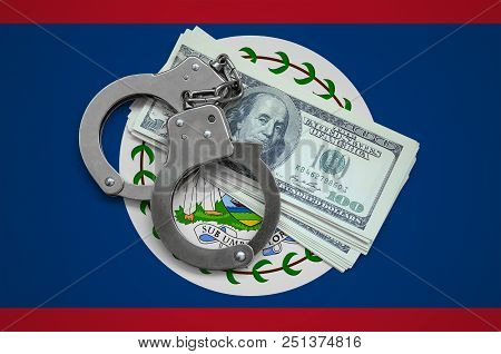 Belize Flag  With Handcuffs And A Bundle Of Dollars. Currency Corruption In The Country. Financial C