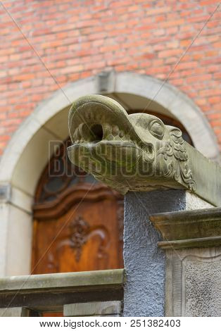Mariacka Street, Grotesque Gargoyle On Front Of Colorful Tenement House, Main City, Gdansk, Poland