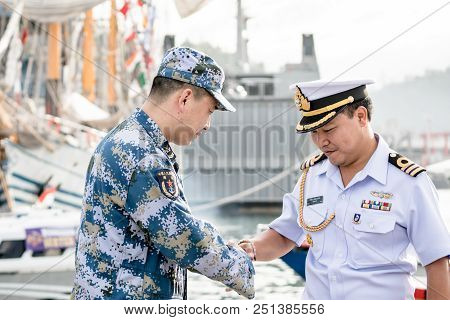 Padang,indonesia - April 13, 2016 :  Royal Thai Navy Officer In White Uniform Shakes Hand With Plan 