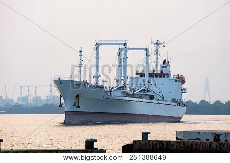 White Reefer Ship Or Refrigerated Cargo Ship Sails In Chao Phraya River In The Evening With Power Pl