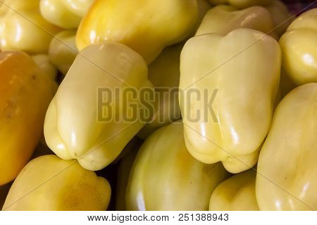 The Fresh Fruits Of The Bulgarian Pepper Are Spread Out In Even Rows In The Shop Window.