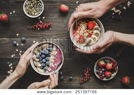 Eating Helthy Breakfast. Delicious Smoothie Bowls With Fruits, Berries And Seeds On The Wooden Backg