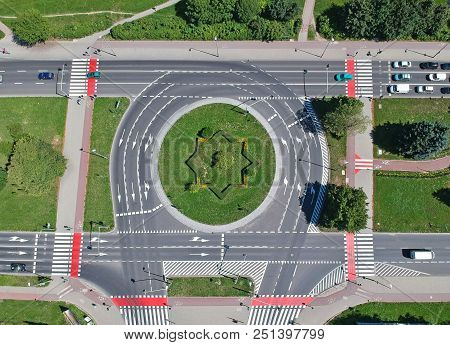 Roundabout Intersection In Four Directions With Island, Aerial View.