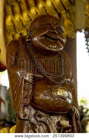 The Figure Of A Chinese Priest, Fat Figure Carved From Wood.