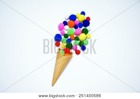 Ice Cream From Multi-colored Pampons In Waffle Horn