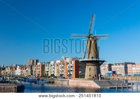The Historic Delfshaven District With Windmill In Rotterdam, The Netherlands. South Holland Region. 