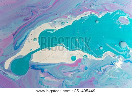 Abstraction Of The Flowing Multi-colored Acrylic Paints
