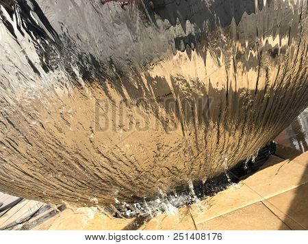 A Picture Of Water Flowing From An Infinity Fountain