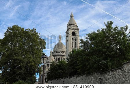 The Basilica Sacre Coeur Is A Roman Catholic Church Located At The Summet Of The Butte Montmartre , 